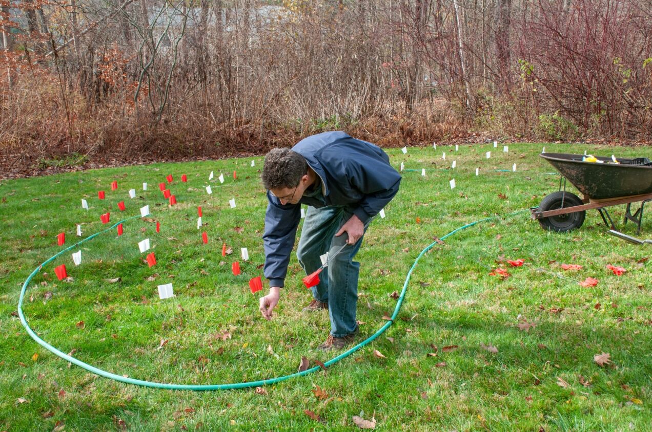 Marking a planting area with flags and hose