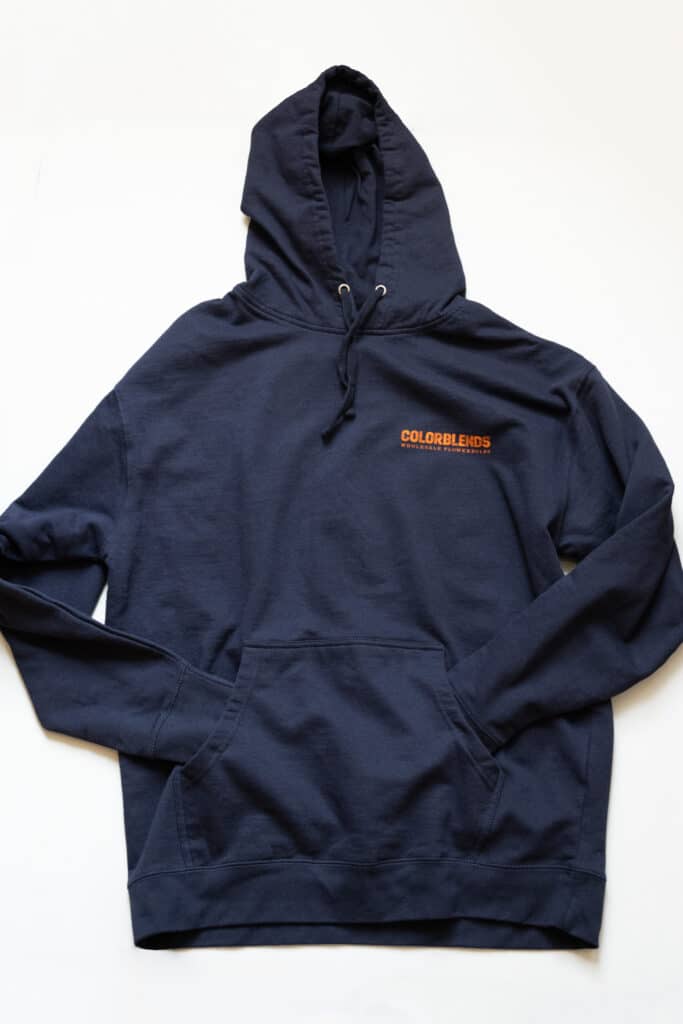 Colorblends Hoodie front. Navy blue with orange Colorblends logo on upper left